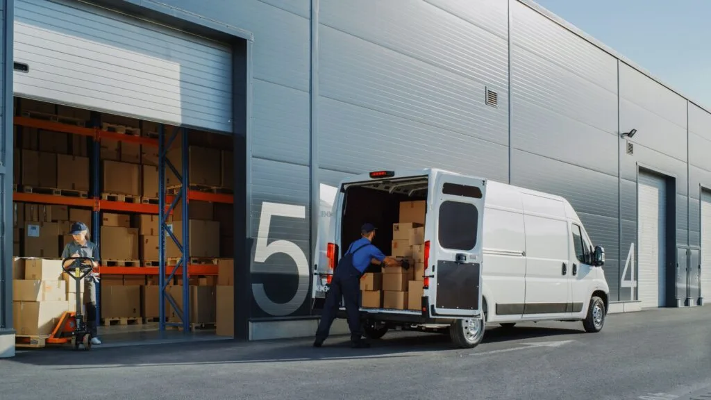 truck loading in front of a warehouse